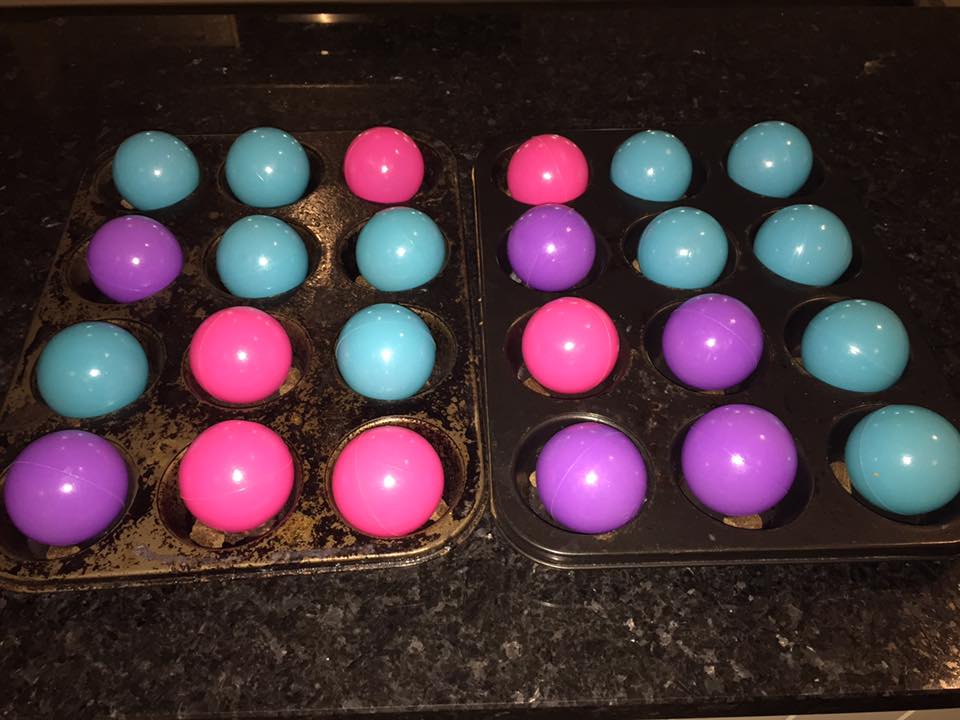 photo of muffin tray with rubber balls in